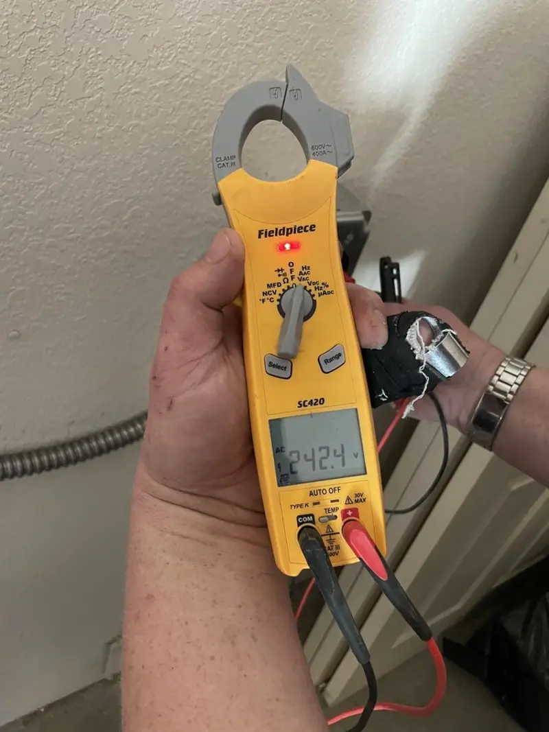 Voltage testing with clamp meter during Recessed Lighting Installation in Berwyn Heights